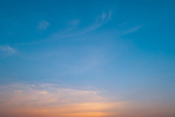 istock Bright orange sunset sky background with gentle colorful clouds, soft focus 1388862552