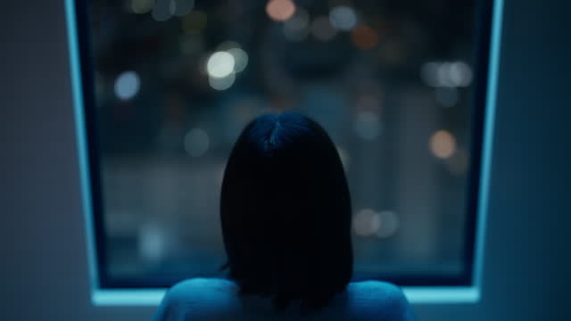 Portrait of woman in dark room at night