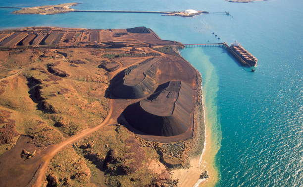 Loading iron Ore on a ship at Dampier. stock photo