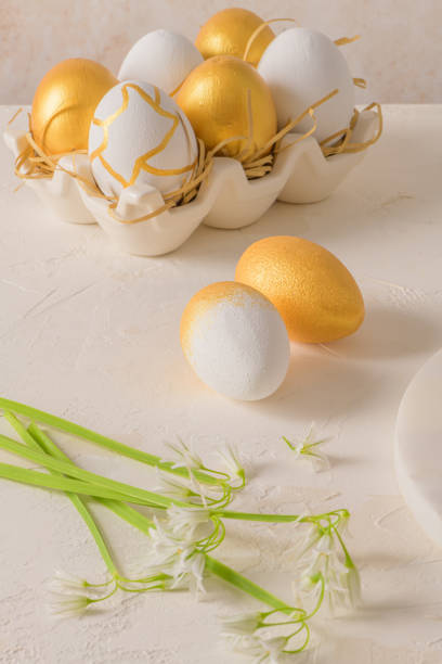 istock Close up of golden and white Easter eggs 1388867529