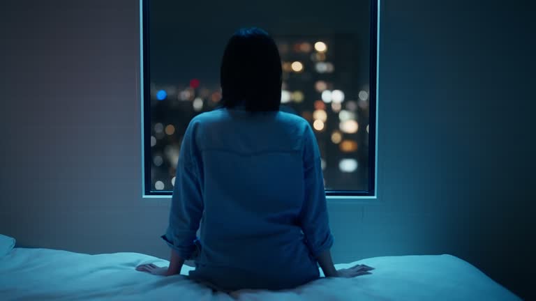 Portrait of woman in dark room at night