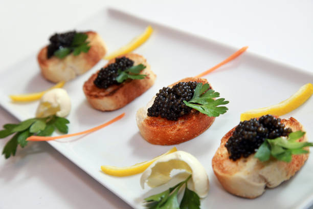 Black caviar with little toast stock photo