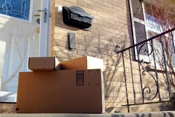 istock Parcels (boxes)  delivery at the front  door outside. 1388879799