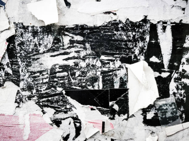 istock Old ripped blank torn grunge posters texture background 1388886546