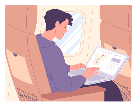 Man with laptop on airplane while in flight.