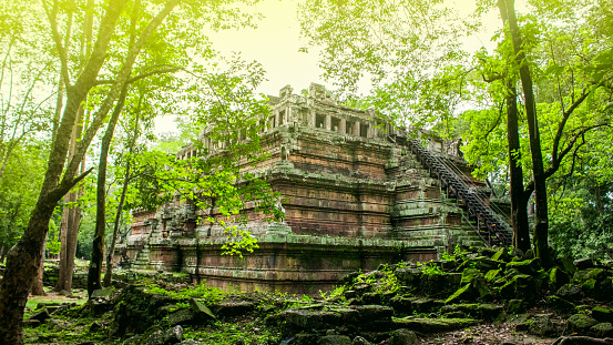 A ruined temple hidden in the jungle of former-royal palace in Angkorian era.