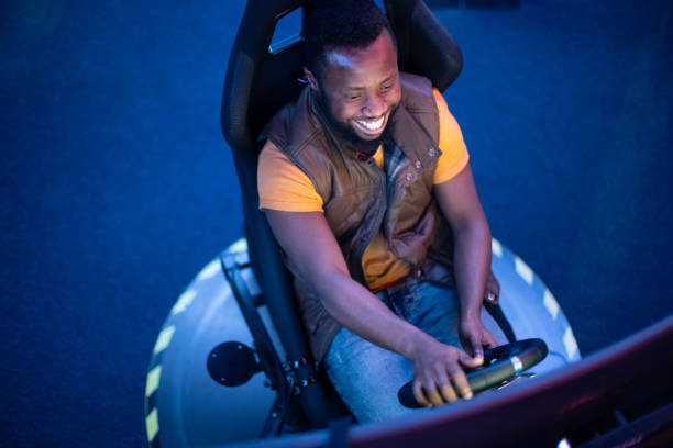 Young African-Amerikan men play car racing online video games