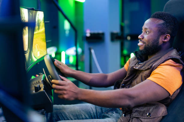 Young African-Amerikan men play car racing online video games