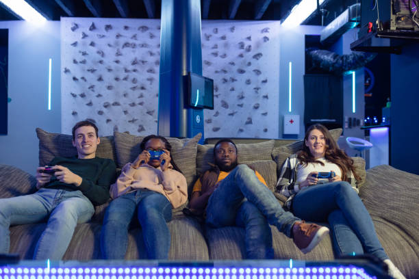 istock Group of friends playing multiplayer video games 1388895648