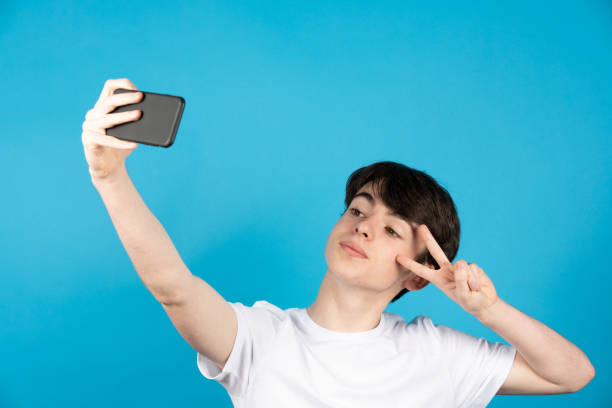 Confident teenager taking selfie