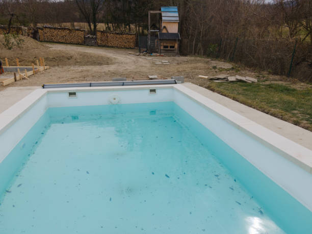 istock Aerial view of pool construction site with stone border 1388896359