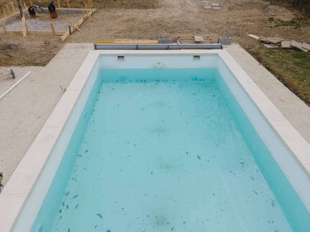 istock Aerial view of pool construction site with stone border 1388897076