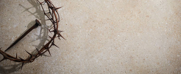 istock Easter concept. Crown of thorns with Nail on a stone background. 1388897082