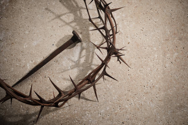 istock Easter concept. Crown of thorns with Nail on a stone background. 1388897207