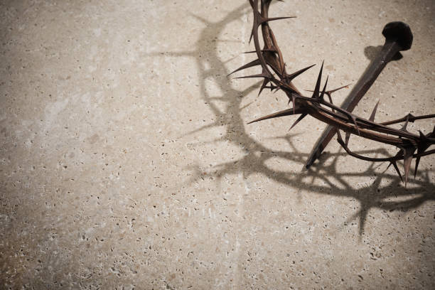 istock Easter concept. Crown of thorns with Nail on a stone background. 1388897281