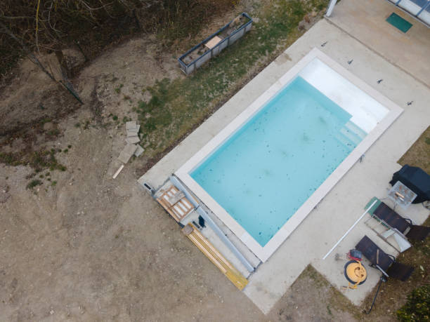 istock Aerial view of pool construction site with stone border 1388897285