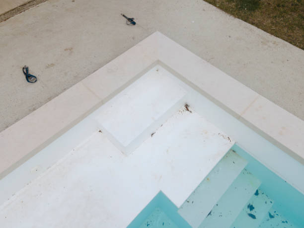 istock Aerial view of pool construction site with stone border 1388897681