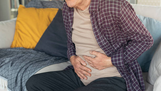 istock Senior man is suffering  stomach pain 1388899104