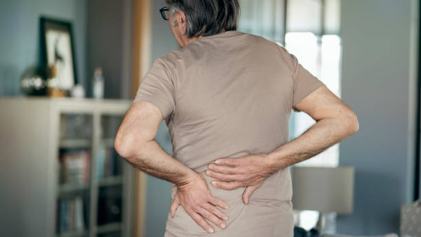 istock Senior man is suffering from pain in lower back at home 1388899131