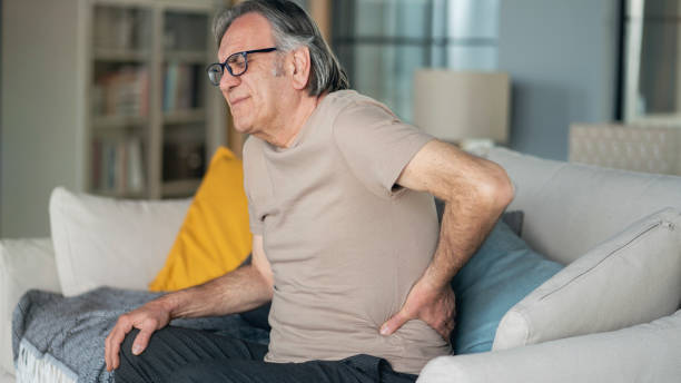 istock Senior man is suffering from pain in lower back at home 1388899162