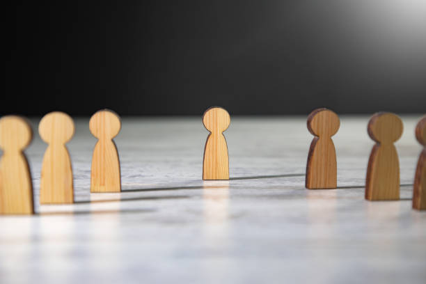 istock Wooden figures people standing. 1388899421