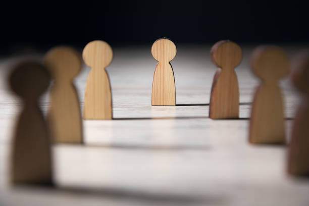 istock Wooden figures people standing. 1388899422