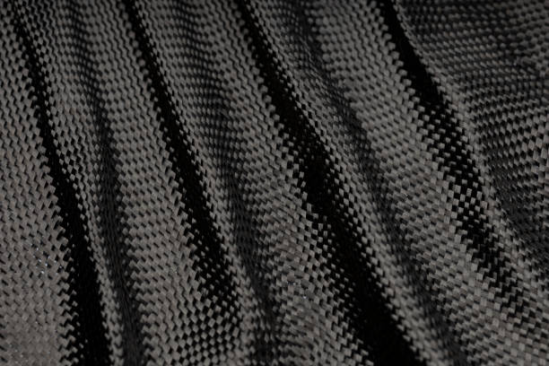surowiec kompozytowy z włókna węglowego na tło - carbon fiber textile pattern zdjęcia i obrazy z banku zdjęć