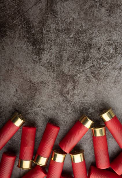 istock Red shotgun shells on texture background , Can be used as a background 1388899529