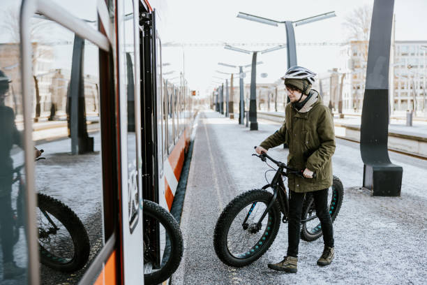 istock Friends with fatbikes, boarding and waiting for a train 1388900320
