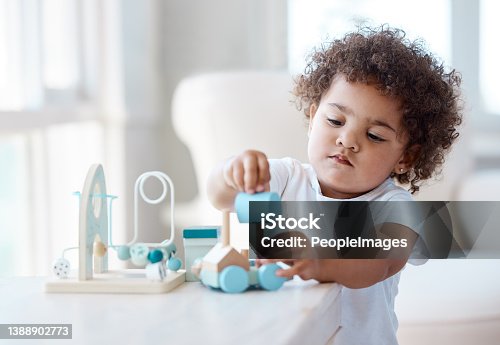 istock Shot of a little girl playing with a toy at home 1388902773