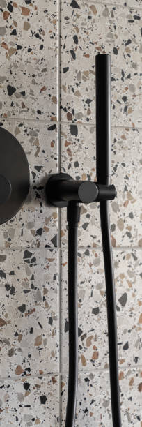 istock Modern black shower head, vertical panorama close-up 1388902934