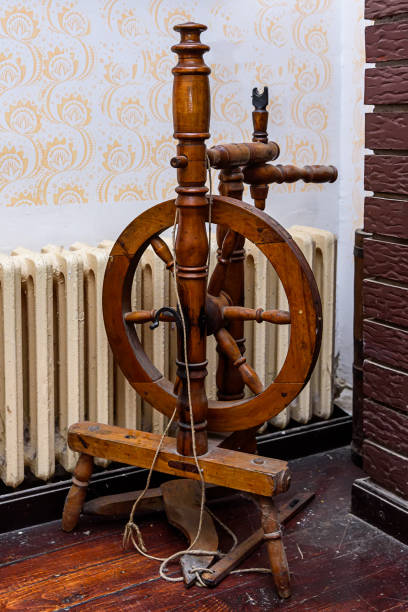 An old wooden spinning wheel.