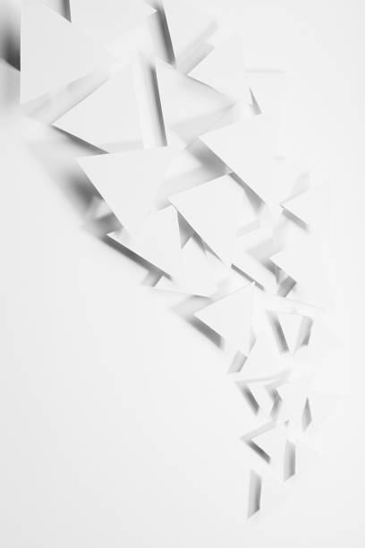 istock Abstract wave or white paper triangles flying in bright light with soft light shadows as flow, border, copy space, top view, vertical. Contemporary simple energy active airy abstract background. 1388905263