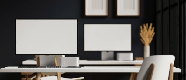 istock Modern office room interior with PC computer against blurred office workspace in the background. 1388905469