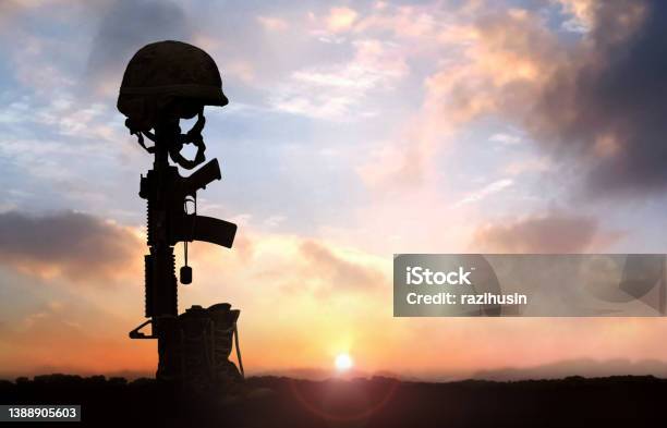 Fallen Soldier Background Concept With Military Helmet Boots And Rifle Stock Photo - Download Image Now