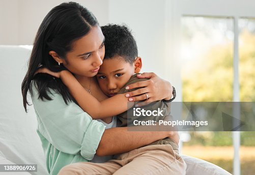 istock Shot of a young mother holding her sick little boy at home 1388906926
