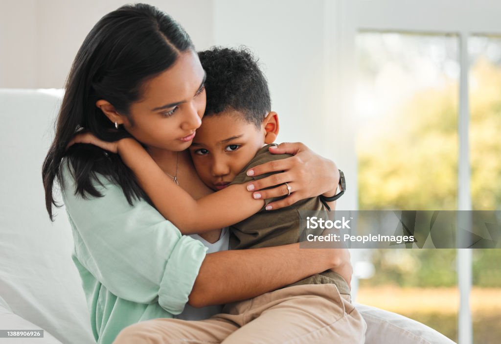 Shot of a young mother holding her sick little boy at home I'll keep you safe Child Stock Photo