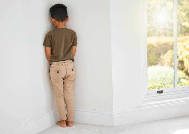 shot-of-a-little-boy-standing-in-a-corner-at-home.jpg