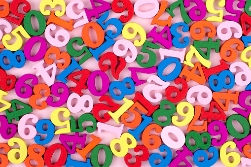 Colorful Wooden Numbers Background. Back to school concept.