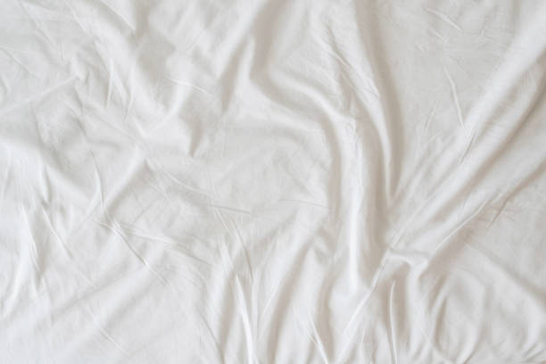 istock The abstract background of the sheets wrinkled when used, causing wrinkles on the white sheets to look uniquely beautiful each time. Unique wrinkles on white sheets each time after use. 1388909926
