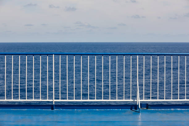 Cruise handrail deck with ocean and sky background. Vacation voyage