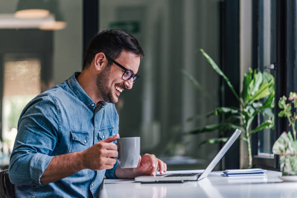istock Happy adult man, having coffee, taking a break from work. 1388912086