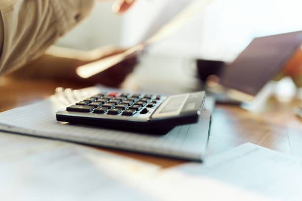 Close up of calculator. Close up of calculator on a note pad. accountancy stock pictures, royalty-free photos & images