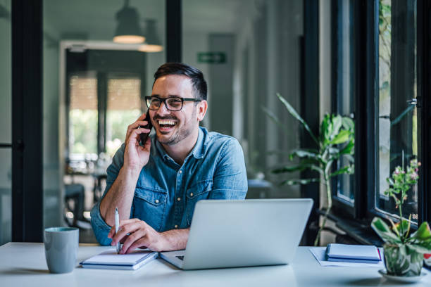 istock Joyful caucasian man, making a phone call to his boss. 1388913209
