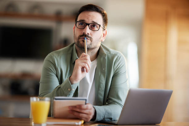 istock Thoughtful male entrepreneur working at home office. 1388913470