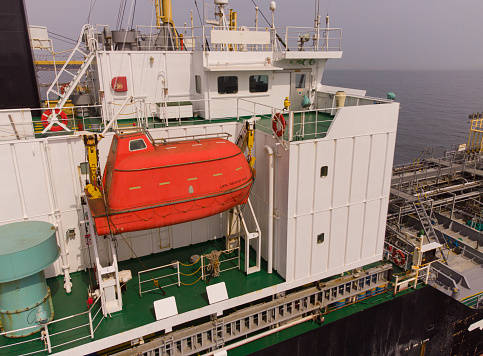 Rescue boat on a large general cargo ship tanker bulk carrier aerial view