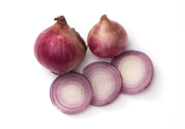 istock Red onion on a white background, Slide and half onion, Allium ascalonicum. 1388917494