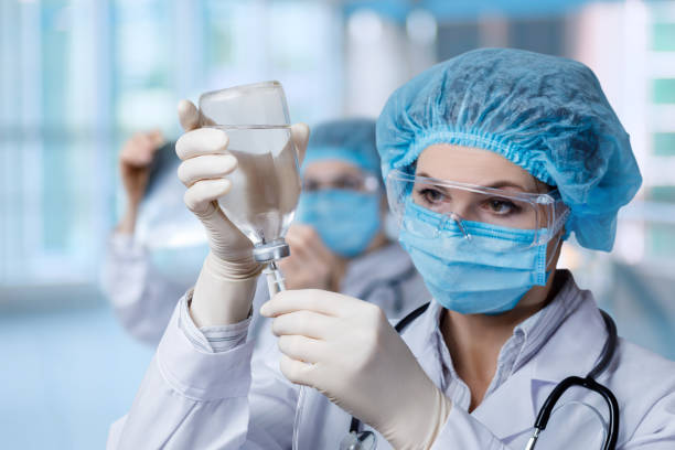 Medical worker prepares a drip of medicen into for installation. stock photo