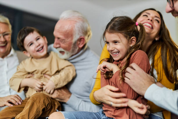 istock Playful extended family having fun at home. 1388917768