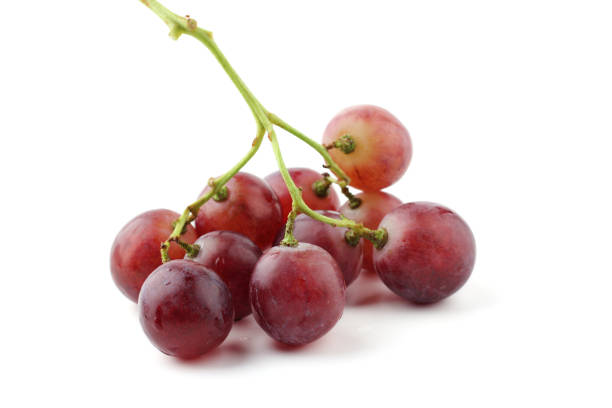 Ripe red grapes isolated on a white background.